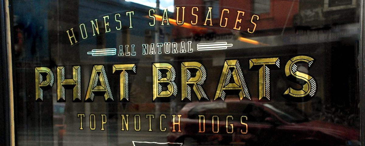Image of Phat Brats Restaurant Brunswick Street Fitzroy Reverse Gold Leaf Gilded Window Sign