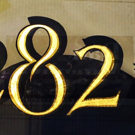 Hand lettered street number on glass using 24ct Gold Leaf Gilding, for 282b Chapel Street.